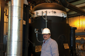 Norm Fischer chief engineer of The Fischer Group. Norm designed a new high-tech way to remove humidity and contaminants from the air, a necessity for industrial manufacturing.